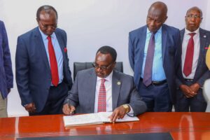 The Cabinet Secretary for Education, Kenya, Hon. Julius Migos Ogamba signs the Visitors’ Book at International Leadership University–Kenya, Kitengela Campus.
